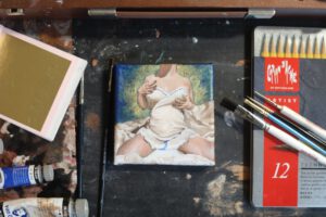 A nude painting on gold leaf